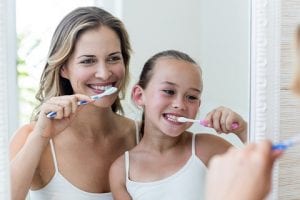 Mother and Daughter Learning How To Brush Teeth by East Ringwood Dental