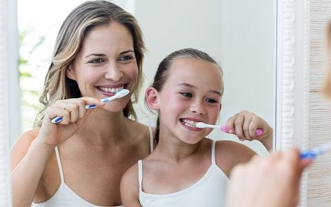 7 BEST DENTAL CARE TIPS AT HOME Mother and Daughter Learning How To Brush Teeth by East Ringwood Dental